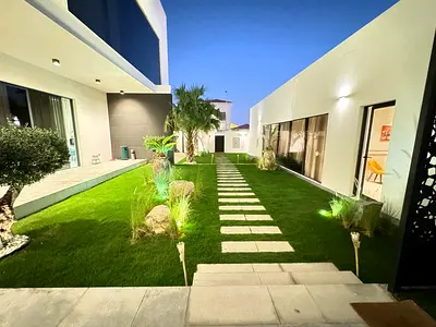 Garden with paved walkway and lawn
