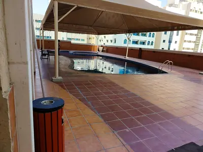 Two-bedroom apartment with a living room available for annual rent in Al Majaz 1. Features two master bedrooms, three bathrooms, a full sea view, and