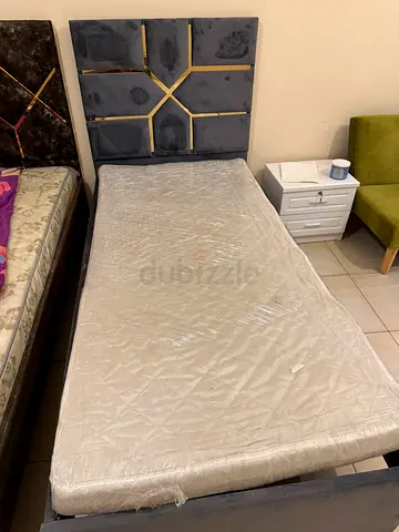 Two single mattresses (wrapped) - good condition