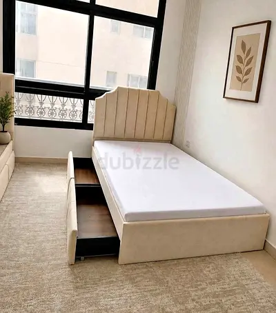 Single beige upholstered storage bed with headboard and under-bed drawers