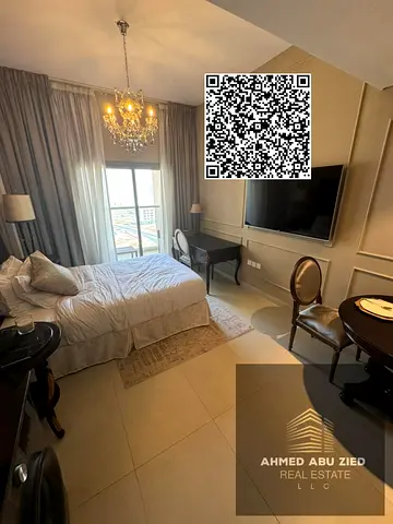 Luxury furnished studio for sale in Azha Garden Residence, hotel-style furniture, open-view balcony, central AC, gym, pool, parking, prime location.
