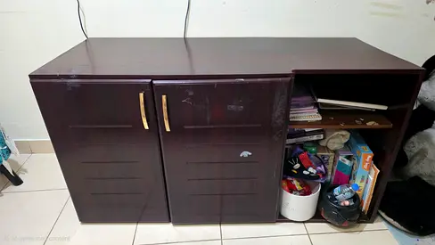Dark wood storage cabinet with shelves — good condition