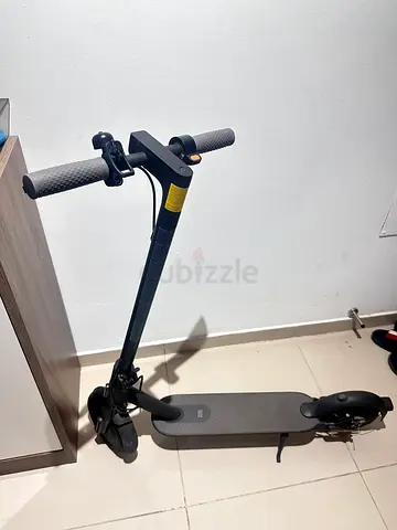 Electric Scooter with Charger and Helmet — Good Condition