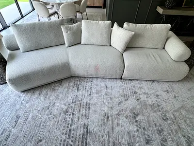 KIT&KABOODLE SOFA - Light beige curved 3-seater sofa with chaise - modern bouclé fabric