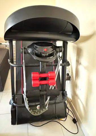 Foldable treadmill with resistance bands and hand weights - good condition