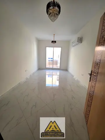 Spacious 1BR in Al Rawda 3, balcony with open view, split AC, AED 30,006 yearly, 4 payments.