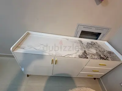 White Marble-Effect Storage Cabinet with Gold Handles console + table with 6 chairs from Homebox