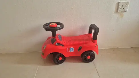 Red ride-on push car for toddlers - good condition