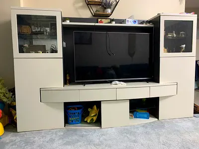 Large modern white entertainment center with glass display cabinets