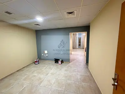 Unfurnished Studio for Monthly Rent in Al Majaz 2 with Distributor, Separate Kitchen, Free AC, Gym