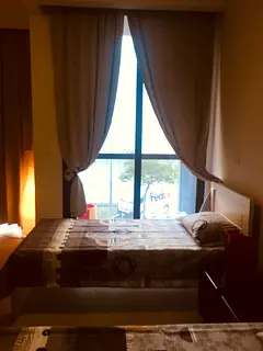 Fully Furnished Room with attached Balcony / Bath for rent for Executive Female behind Burjuman