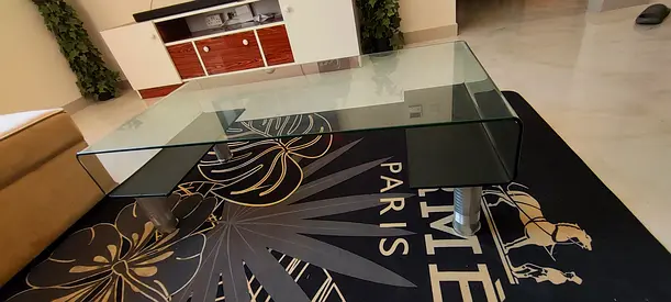 Glass Coffee Table with Curved Design and Metal Legs