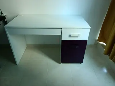 Simple white study desk with drawer and purple cabinet