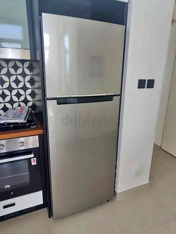 Used two-door fridge/freezer in good condition - stainless finish