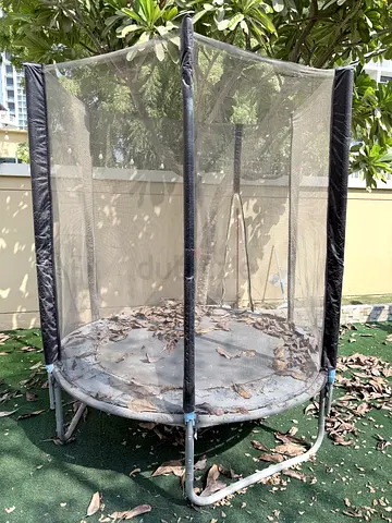 Small round trampoline with safety net - good for kids - like new just need a clean