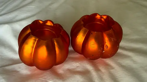 Pair of orange tealight pumpkin candle holders for Halloween