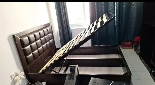 Double storage bed frame with hydraulic lift and headboard - dark wood