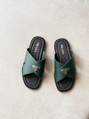 Authentic Prada green cross-strap leather slides - size unspecified