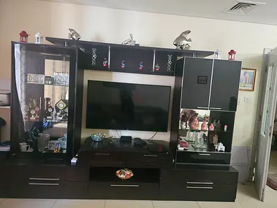 Large dark wood entertainment center / TV unit with display cabinets