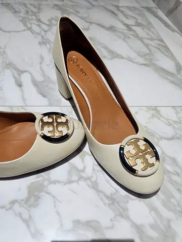 Tory Burch white leather mid-heel pumps, size unknown, gently used.