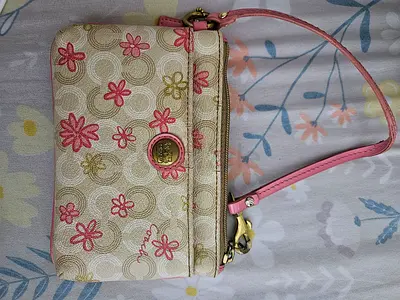 Coach wristlet clutch in beige with pink floral print — used authentic