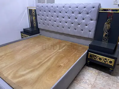 King size upholstered bed frame with built-in bedside tables and headboard