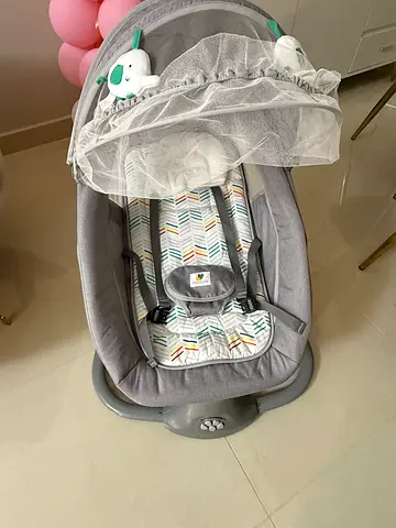 Mastela baby swing/rocker with mosquito net and toy - gently used ( under guarantee ) from babyshop