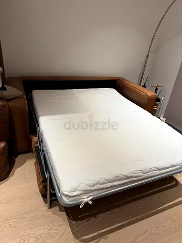 Sofa bed with pull-out mattress in fair condition