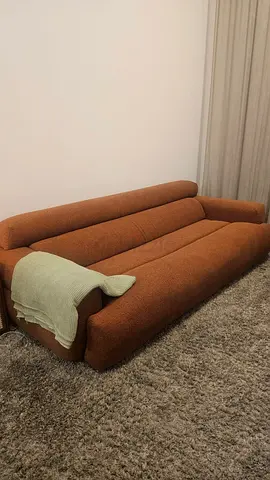 Three-seater Orange brown fabric sofa in good condition