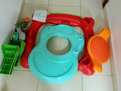 Used toddler potty seat with detachable splash guard and toys - good condition