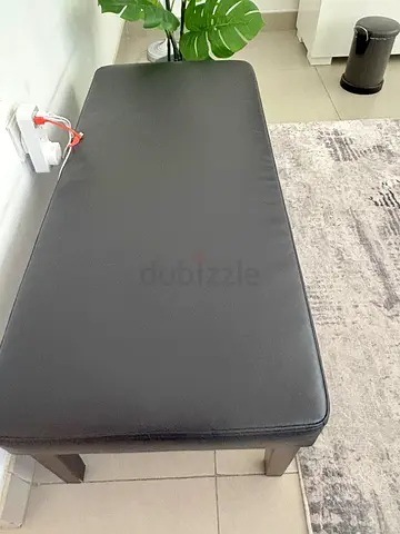 Simple black faux-leather bench with wooden legs - perfect condition