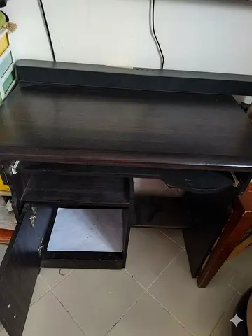 Compact dark wood computer desk with storage cabinet and pull-out keyboard tray
