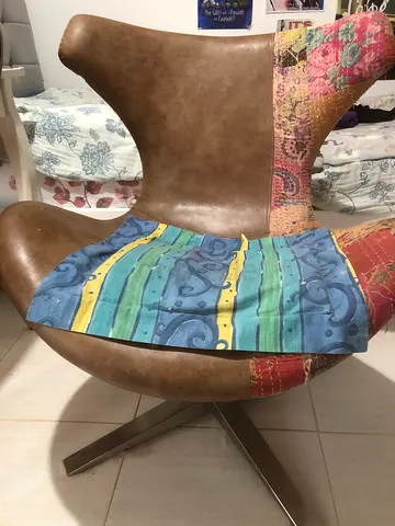 MOVING OUT SALE! Swivel lounge chair selling to go!