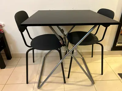 Ikea foldable black dining table with 2 chairs - modern, space-saving