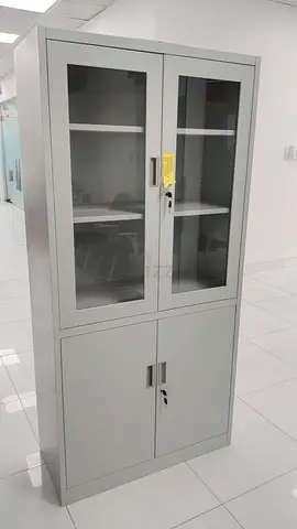Grey metal storage cabinet with glass upper doors and lockable lower compartment