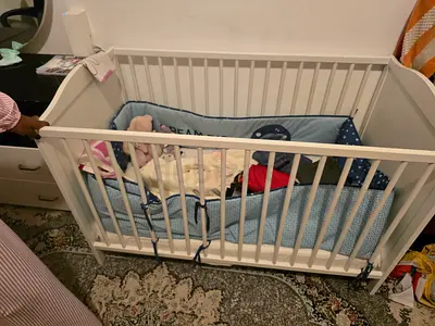 White Wooden Baby Crib with Bumper - Good Condition
