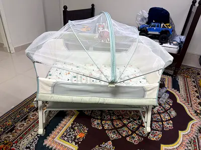 Portable baby bassinet/crib with mosquito net - light green, Very good Condition. Only one month use
