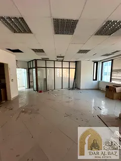Office for annual rent in Al Majaz 1 | Area: 1,345 sq. ft. | Free A/C | Parking available | 3 months