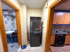 Monthly Studio for Rent in Al Majaz 2 with Separate Kitchen, Built-in Wardrobes, Central AC, Free Gy