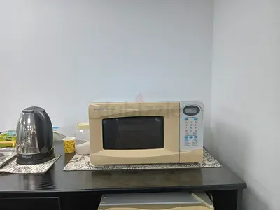 Sharp Microwave Oven (used) - Beige, Compact countertop model