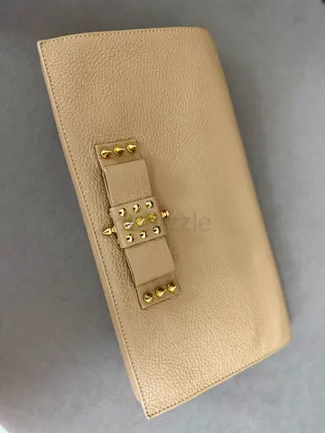 Beige leather studded clutch wallet