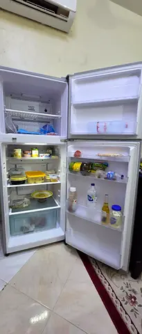 Used double-door refrigerator in working condition. Very cold and has thermoster.