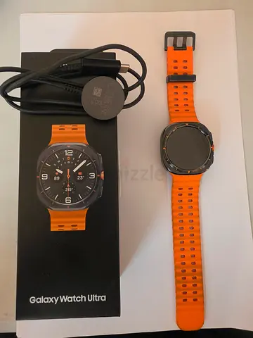 Samsung Galaxy Watch Ultra 2025 (orange strap) with charger and box - used