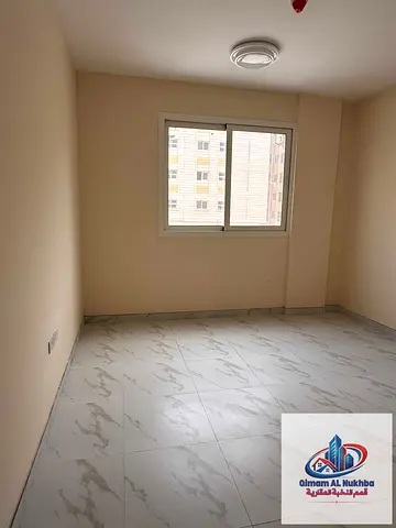 1st tenant near Corniche Al Majarra: 1BR, central AC/gas, free maintenance, flexible pay, prime location, easy Dubai exit.