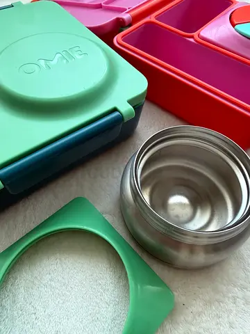 Used OMIE stainless food jar and silicone suction plate set - very good condition. 100 AED each