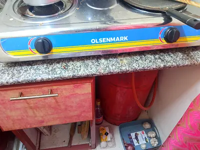 Empty gas cylinder with stove and regulatar