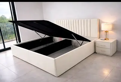 Queen size storage bed with hydraulic lift, white upholstered headboard