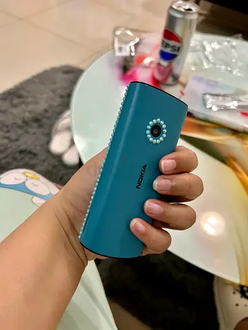 Nokia blue mobile phone beautifully bedazzled, fully functional.