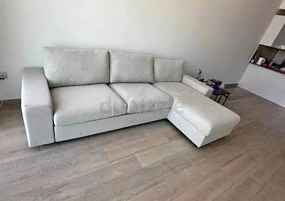 Light Beige L-shaped sofa bed with storage chaise good condition