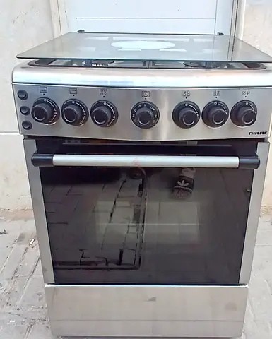 NIKAI gas cooker with 4 burners size is 60x60cm. condition is properly working.